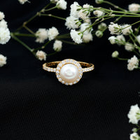 Rosec Jewels cultured 7.4 carat freshwater pearl diamond engagement ring with a halo setting, showcasing elegant design and sparkling stones.