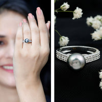 Natural Tahitian pearl cathedral engagement ring with diamond side stones, featuring elegant rose gold band and intricate design.