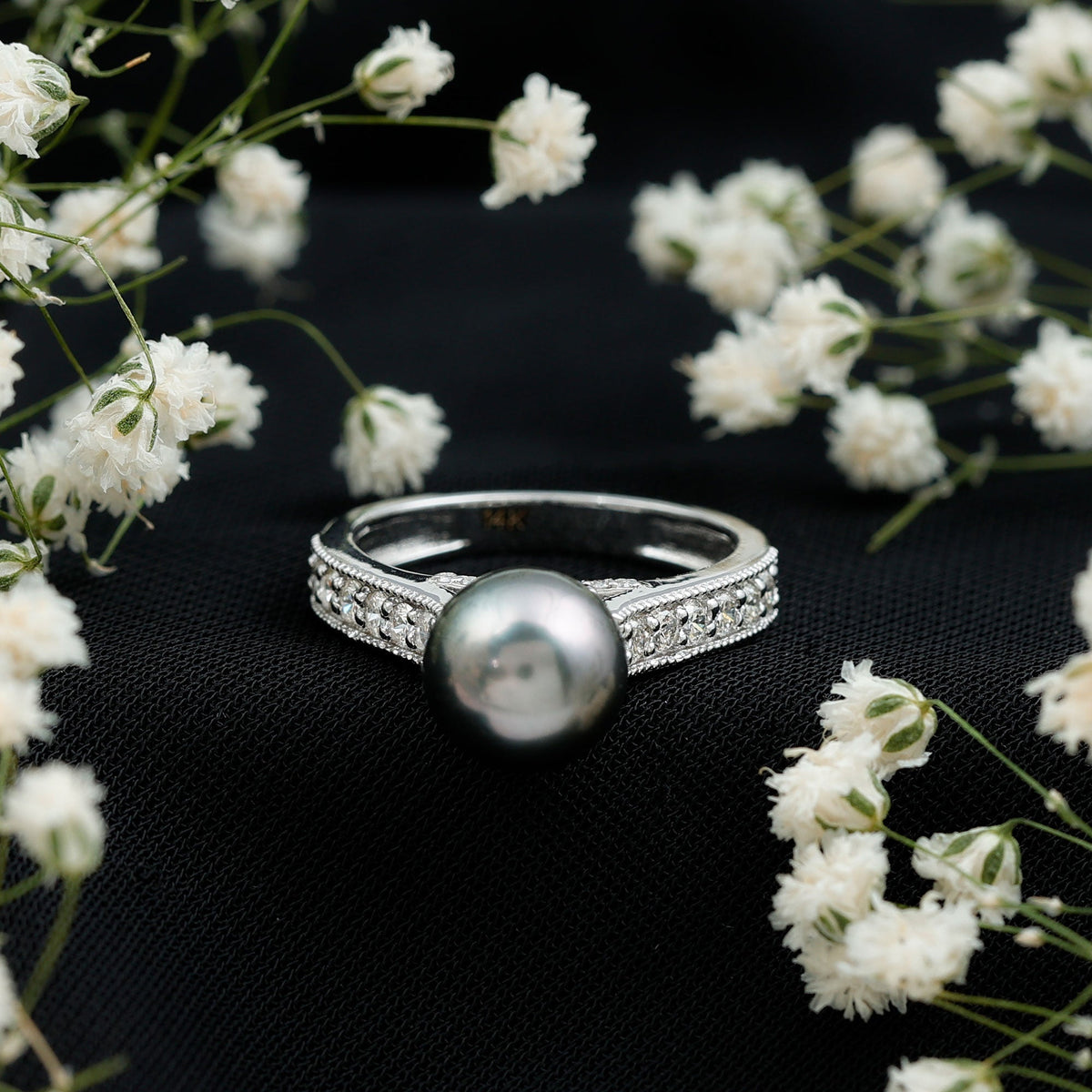 Natural Tahitian pearl cathedral engagement ring with diamond side stones by Rosec Jewels, featuring a lustrous black pearl centerpiece.