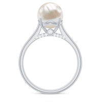 Freshwater pearl solitaire with diamond ring by Rosec Jewels, showcasing a elegant pearl and diamond set in a delicate gold band.