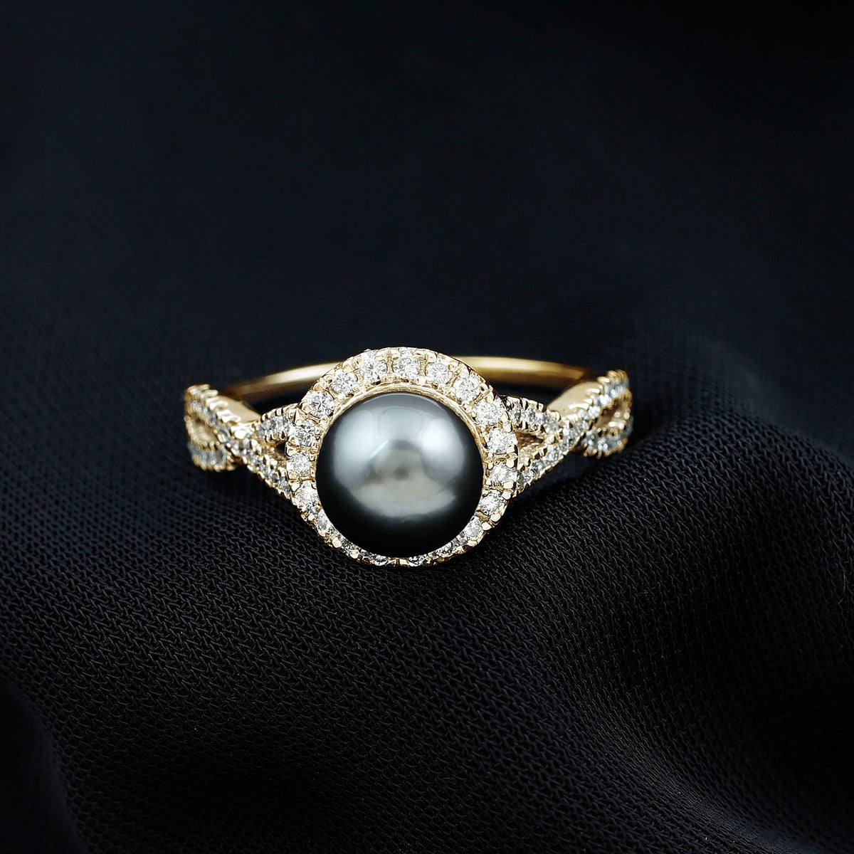 Real Tahitian pearl and diamond crossover engagement ring by Rosec Jewels, showcasing a pearl with sparkling diamonds in a sleek ring setting.