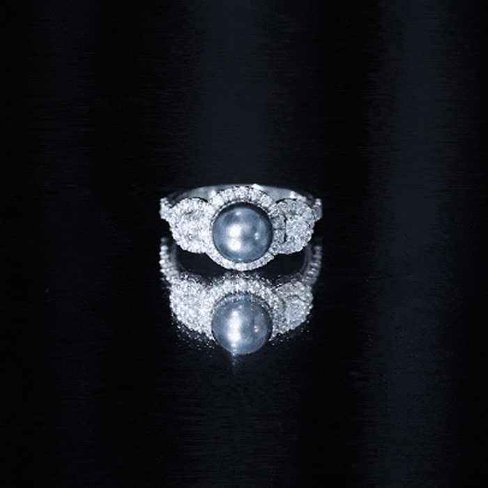 7.5 carat round black pearl engagement ring with moissanite accents by Rosec Jewels, showcasing the elegant ring design.