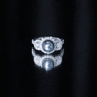 7.5 carat round black pearl engagement ring with moissanite accents by Rosec Jewels, showcasing the elegant ring design.