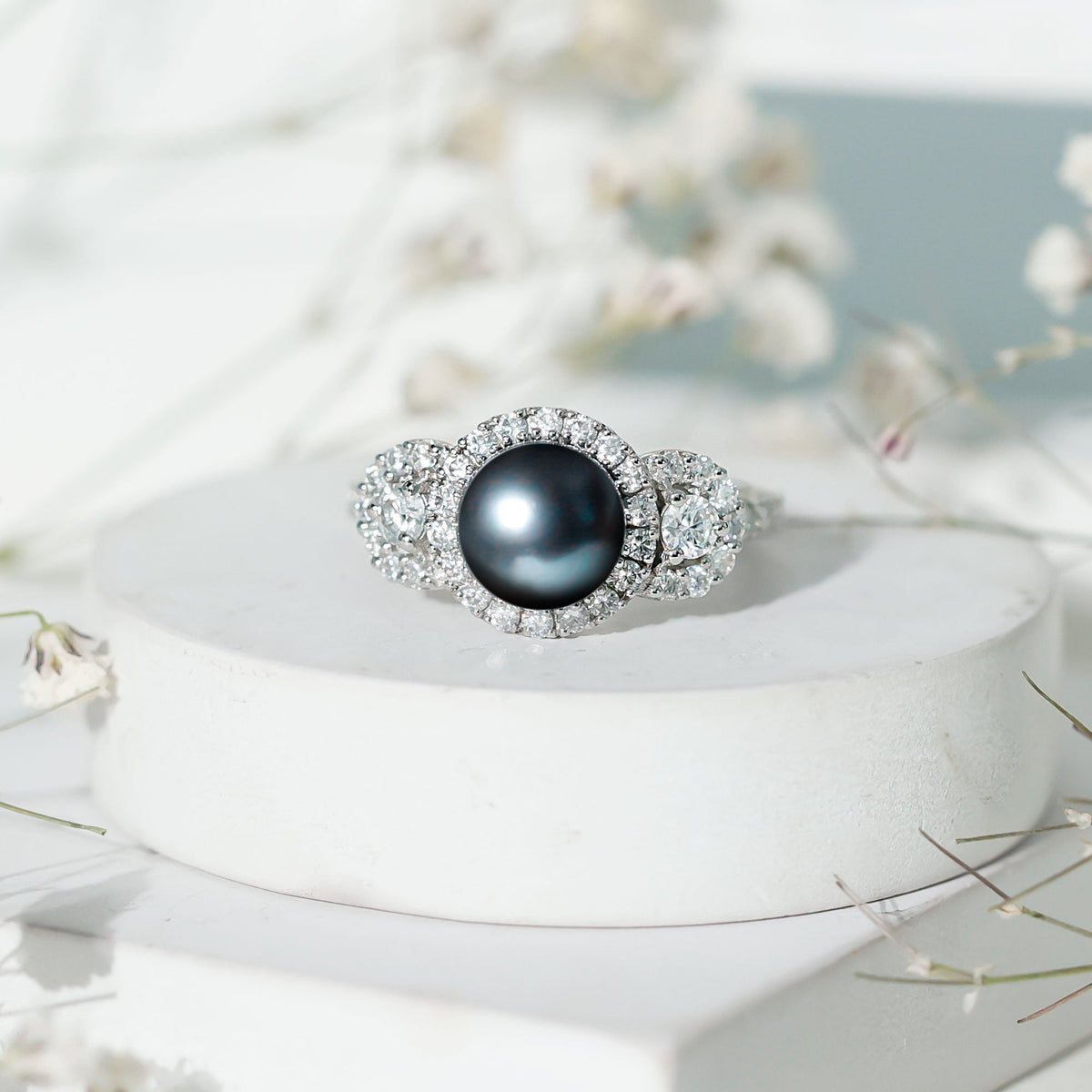 7.5 carat round black pearl engagement ring with moissanite accents from Rosec Jewels, showcasing the elegant ring design.