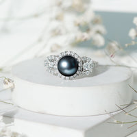 7.5 carat round black pearl engagement ring with moissanite accents from Rosec Jewels, showcasing the elegant ring design.