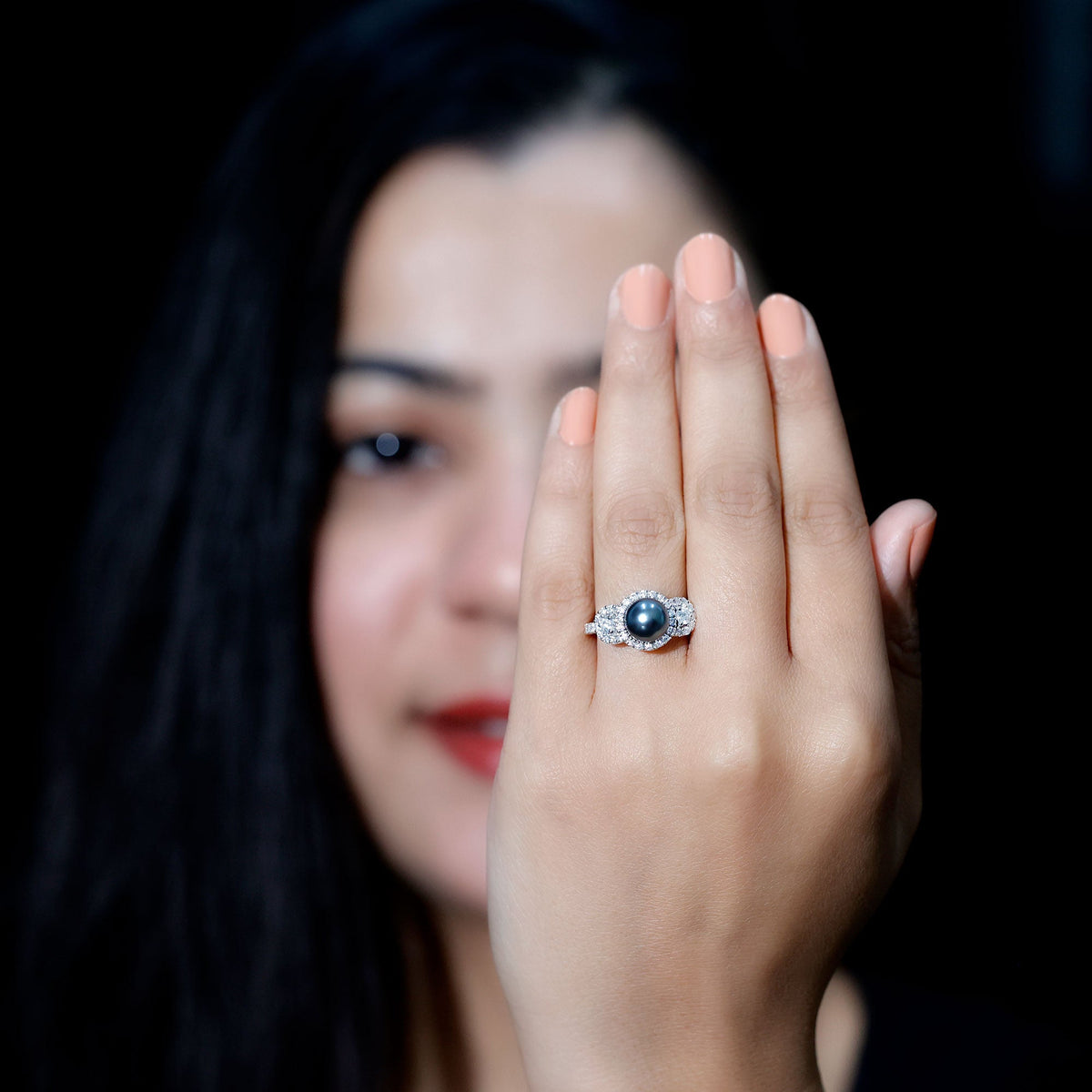 7.5 carat round black pearl engagement ring with moissanite accents by Rosec Jewels, showcasing a sleek ring design.