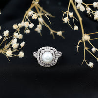 Rosec Jewels 7.4 carat freshwater pearl double halo engagement ring with sparkling moissanite and intricate band design.