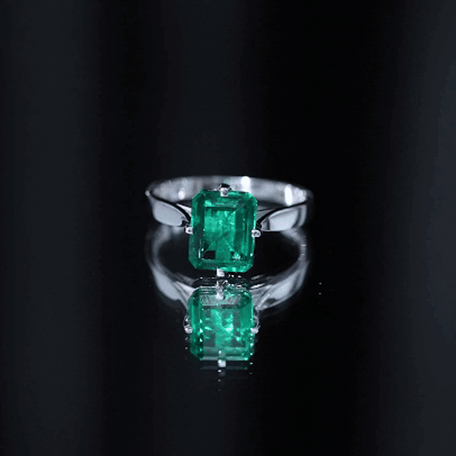 Yellow gold engagement ring featuring an 8x10 mm octagon lab-grown emerald solitaire by Rosec Jewels.