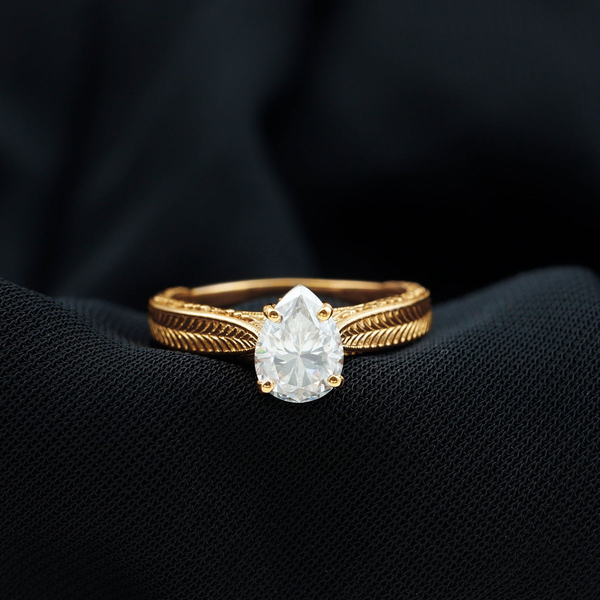 Claw Set Pear Shape Moissanite Engagement Ring