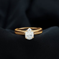 Claw Set Pear Shape Moissanite Engagement Ring