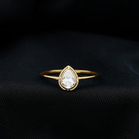 Pear Shaped Moissanite Solitaire Engagement Ring in Bezel Setting
