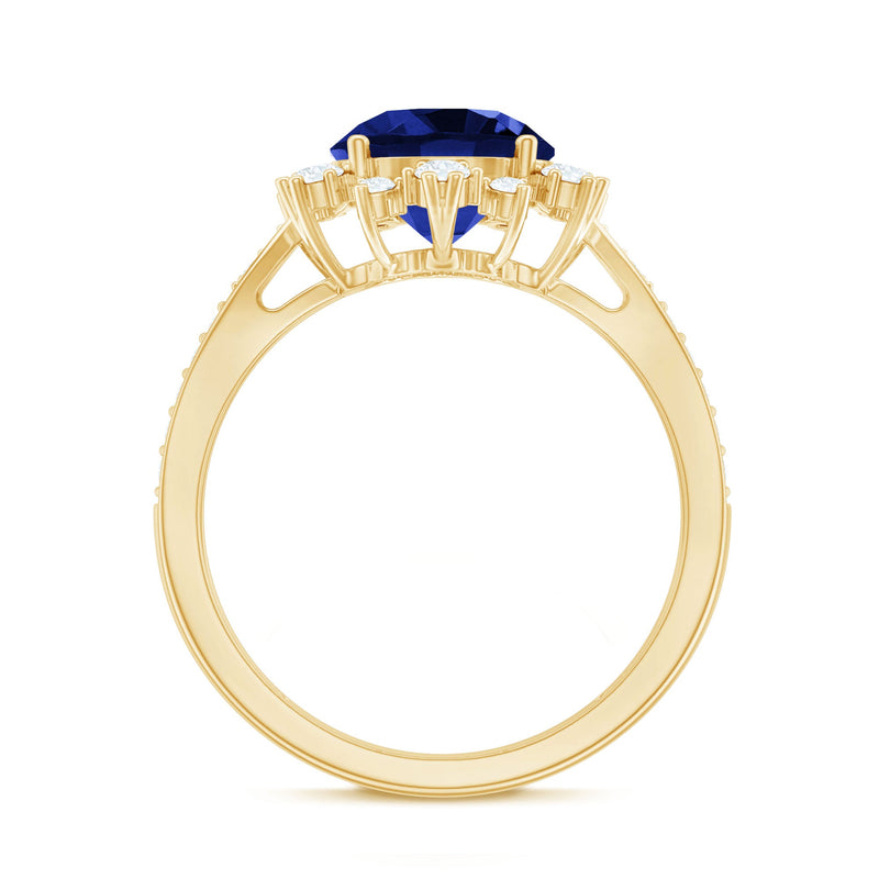 Lab-grown blue sapphire round engagement ring with diamond accents from Rosec Jewels, showcasing the elegant gemstone and detailed band.