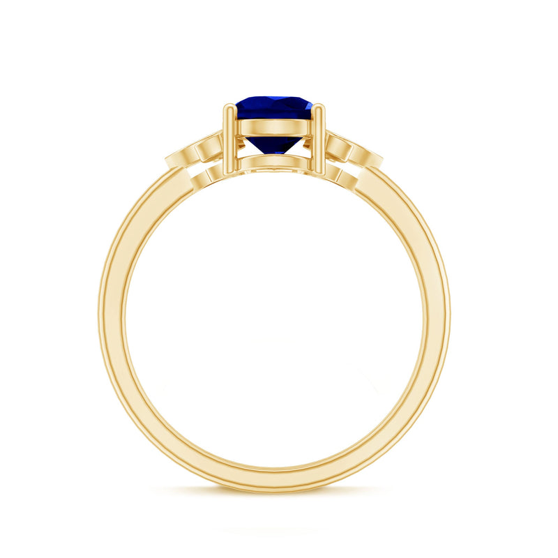Lab-grown blue sapphire teardrop engagement ring with diamonds from Rosec Jewels, showcasing the elegant ring design.