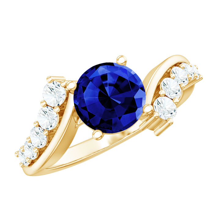 Lab grown blue sapphire engagement ring with diamond bypass shank by Rosec Jewels, showcasing the 2.7 carat center stone and elegant design.