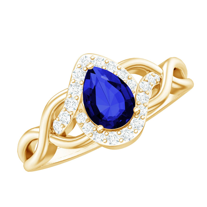 Rosec Jewels 1.6 Carat lab-grown blue sapphire diamond teardrop engagement ring with crossover shank and intricate detailing.