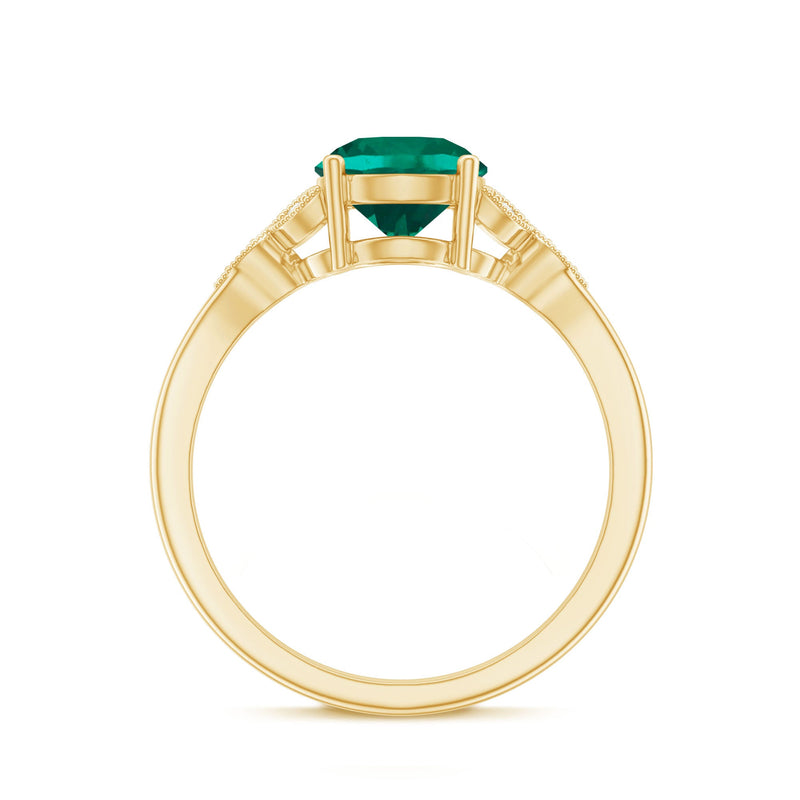 Rosec Jewels lab-created emerald solitaire engagement ring with a diamond accent, showcasing a green emerald center stone and elegant band.