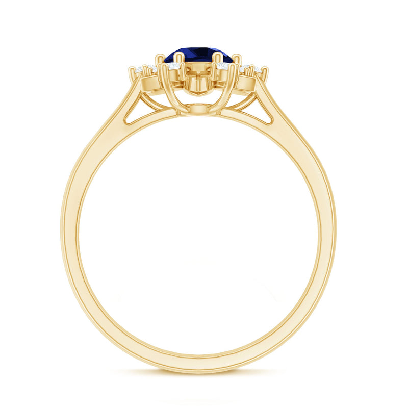 Lab grown blue sapphire flower engagement ring with diamonds, featuring a 0.6 carat center stone, by Rosec Jewels.