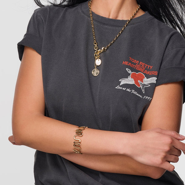 Gold Voyager Necklace by Mignonne Gavigan featuring delicate chain and elegant pendant, displayed on a neutral background.