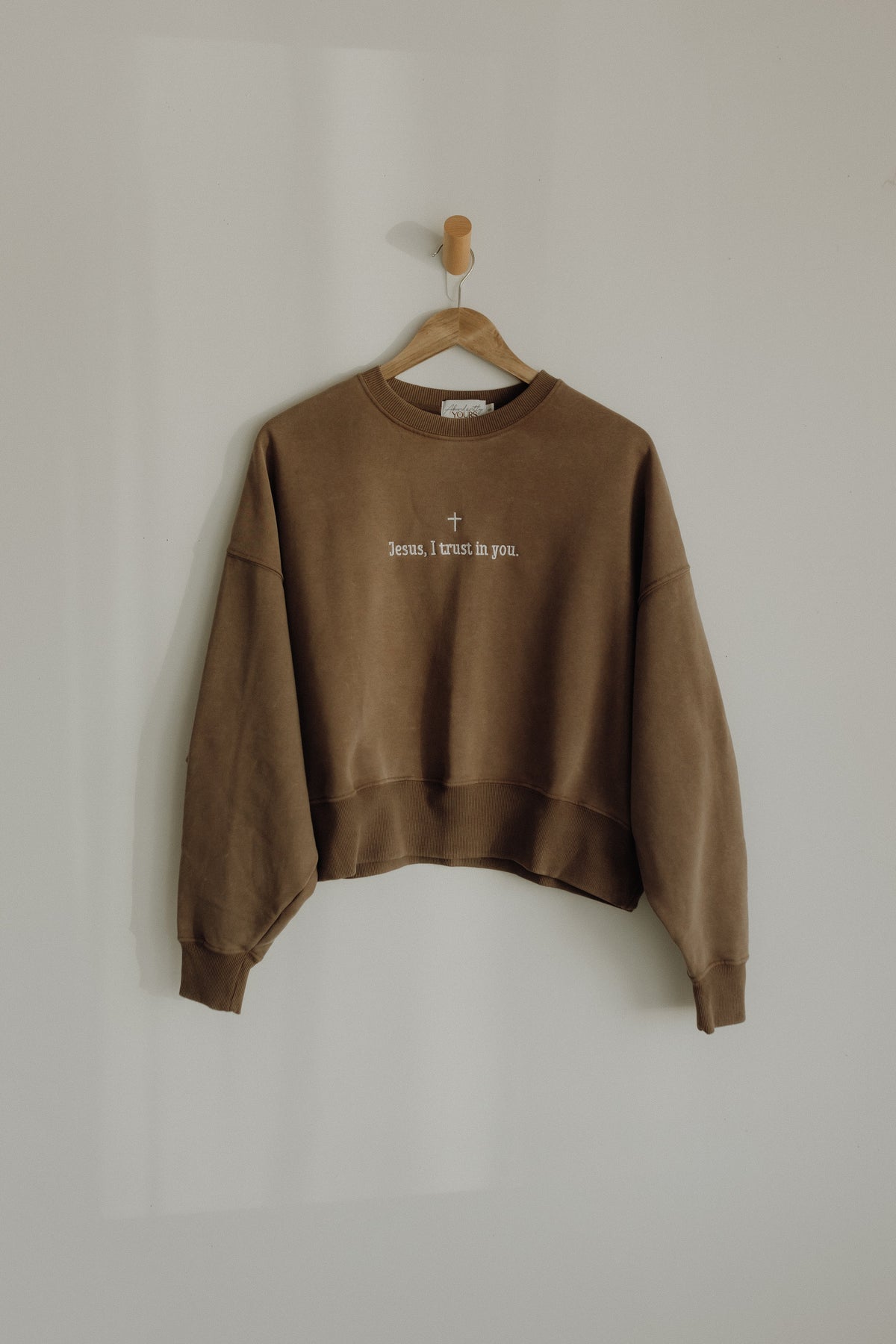 Cropped crew neck t-shirt featuring the phrase "Jesus, I Trust in You" in black lettering, from Abundantly Yours Shop.