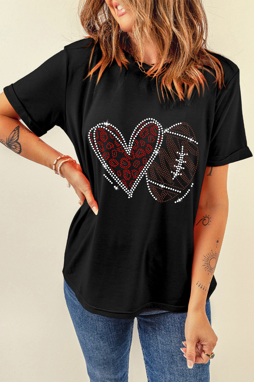 Black Rhinestone Love Football T-shirt by Adelyne's Boutique featuring a football-themed design with sparkling rhinestones.