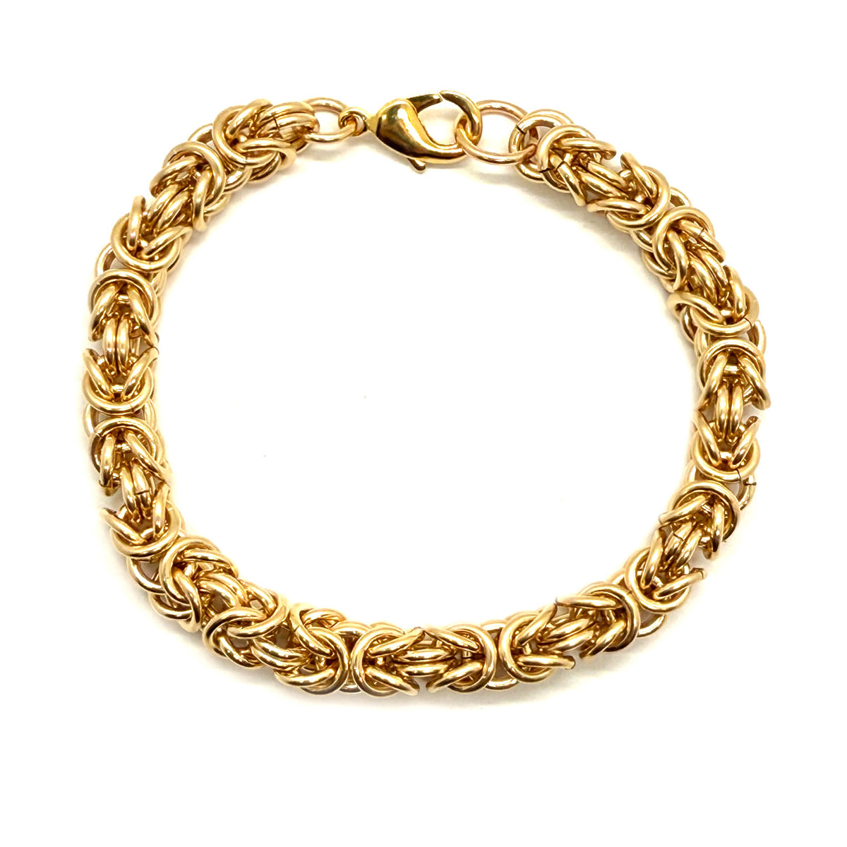 14K gold fill Byzantine chainmaille bracelet with chunky links and lobster claw clasp, styled as a jewelry accessory.