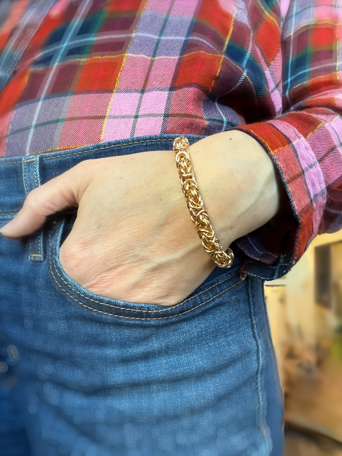14K gold-filled chunky Byzantine chainmaille bracelet by Alison Morse worn on a model's wrist.