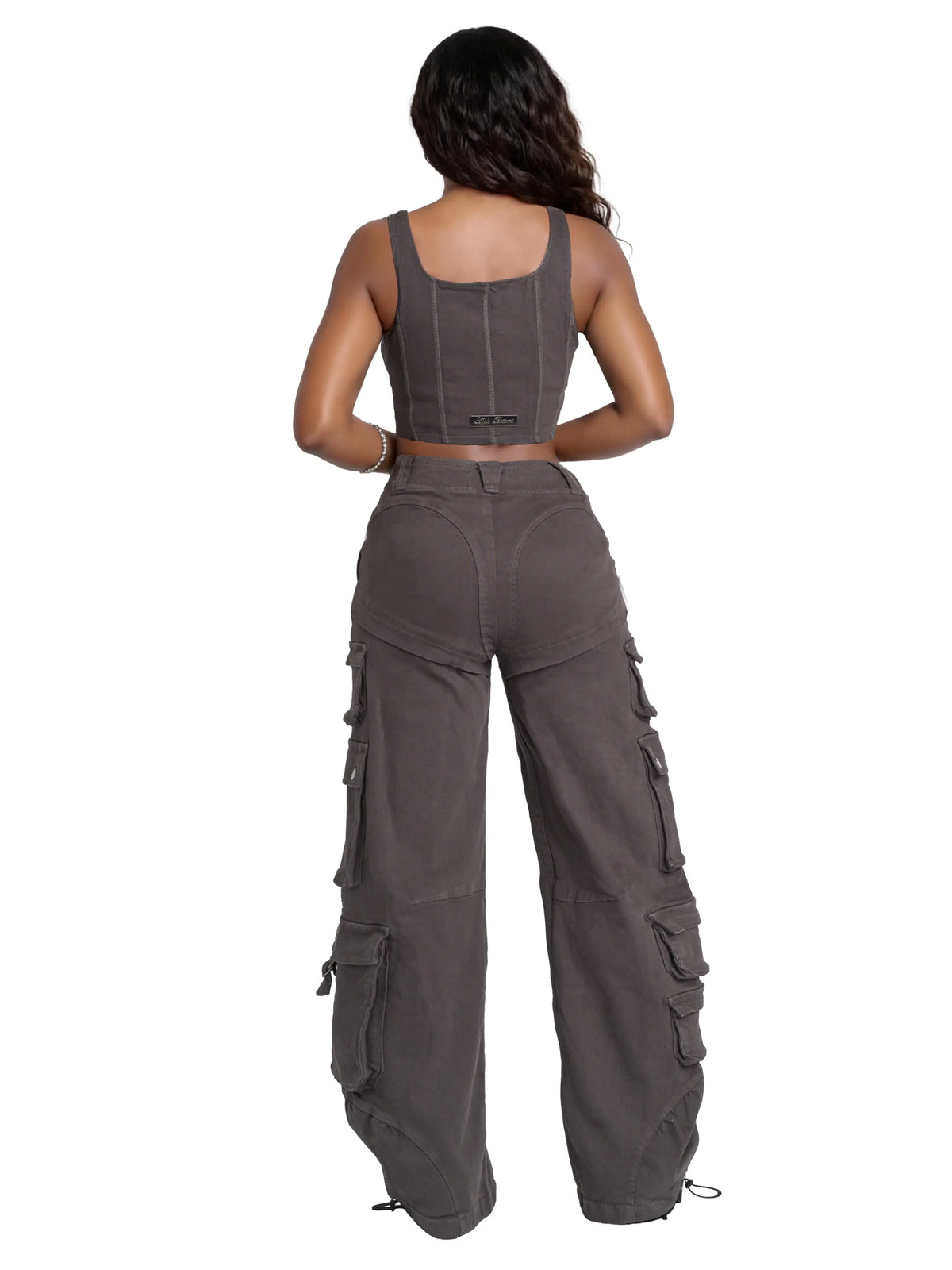 Low-rise twill cargo pant from Apple Bottom Jeans featuring multiple pockets and a relaxed fit, displayed on a hanger.