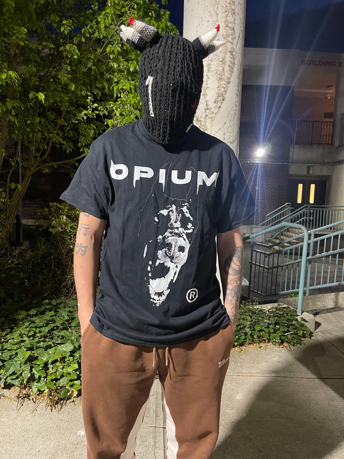 Opium Dobermann Streetwear T-Shirt by ArnukiClothing featuring bold graphic design and casual fit, displayed on a mannequin.