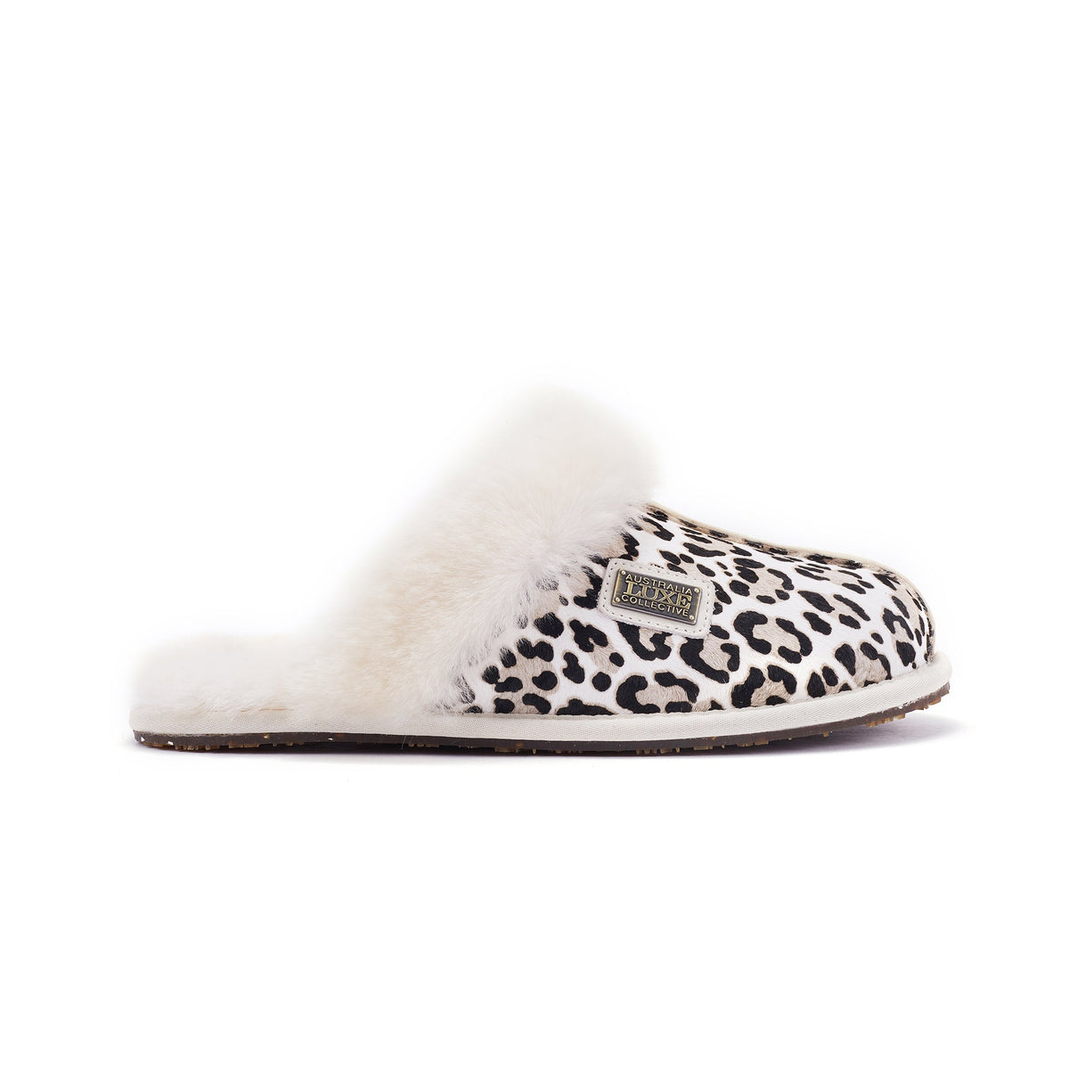 Australia Luxe Collective closed mule slippers in snow leopard print, featuring plush material and slip-on style.