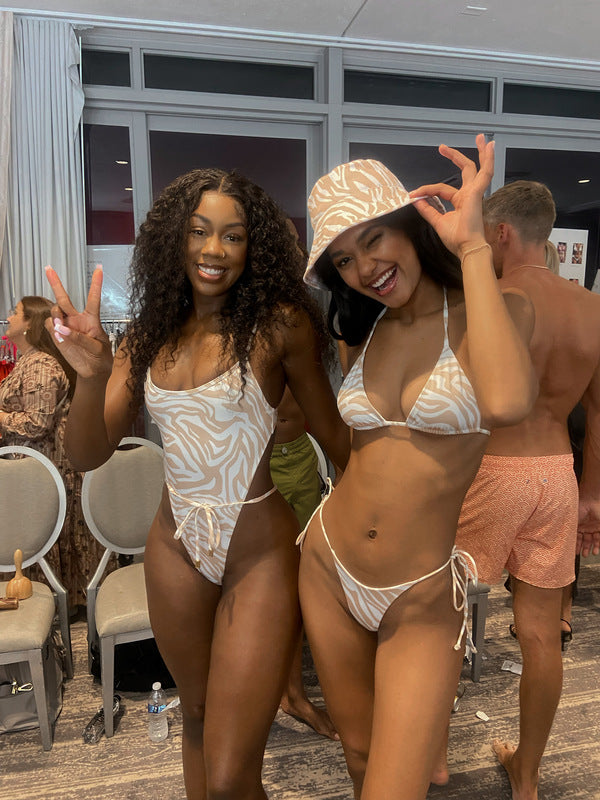 Beau Swim Samira One Piece swimsuit featuring a tiger print in XS size, with a fitted design and vibrant tiger pattern.