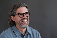 Green Gianna reading glasses by Benny's Eyewear with clear lenses and stylish frame design.