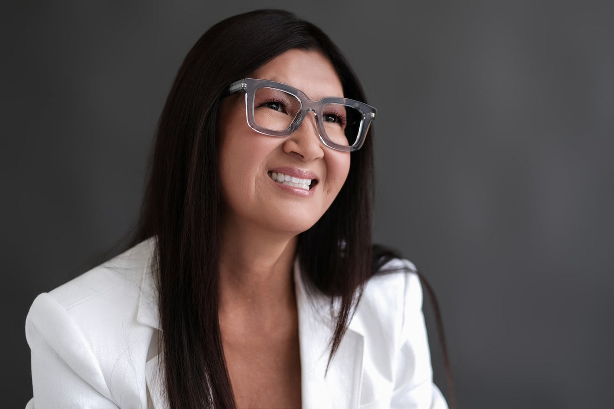 Green Gianna reading glasses by Benny's Eyewear with clear lenses, stylish and lightweight for comfortable reading.