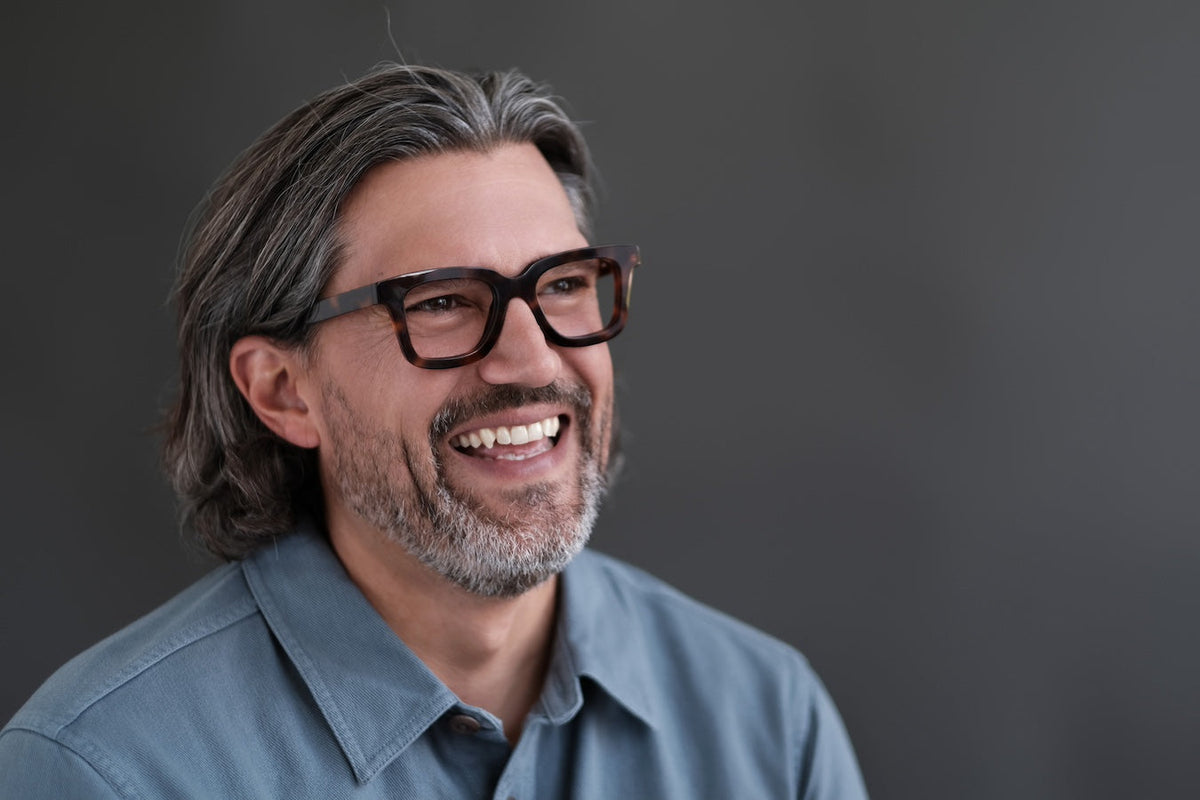 Green Gianna reading glasses by Benny's Eyewear with clear lenses and stylish frame.
