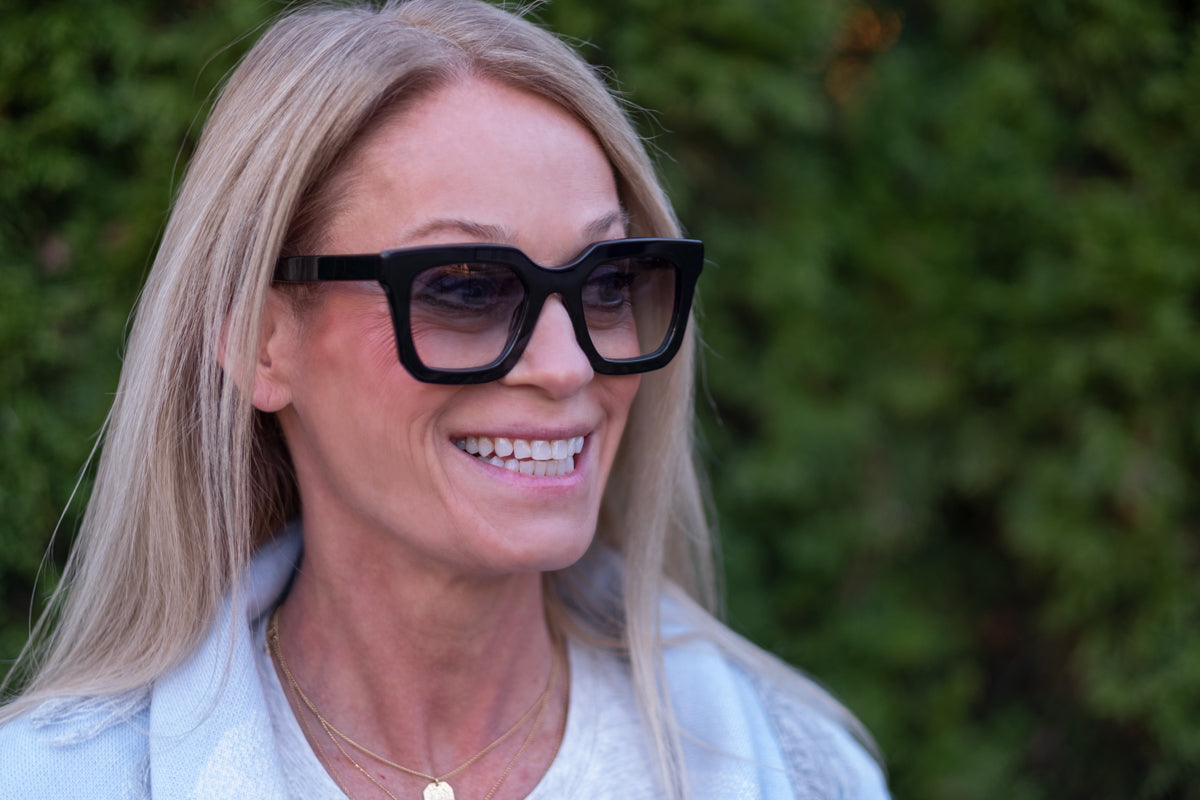 Gray Nora sunglasses by Benny's Eyewear with sleek frame and tinted lenses, perfect for stylish sun protection.