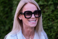 Benny's Eyewear Ann sunglasses with grey tinted lenses and sleek black frames, stylish and UV-protective sunglasses for everyday wear.