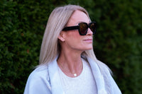 Grey Ann sunglasses by Benny's Eyewear with sleek frame and tinted lenses, stylish eyewear for sun protection.