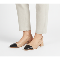 Menina Step Berta slingback nude shoes with pointed toes and elegant design, shown from a side angle on a lifestyle background.