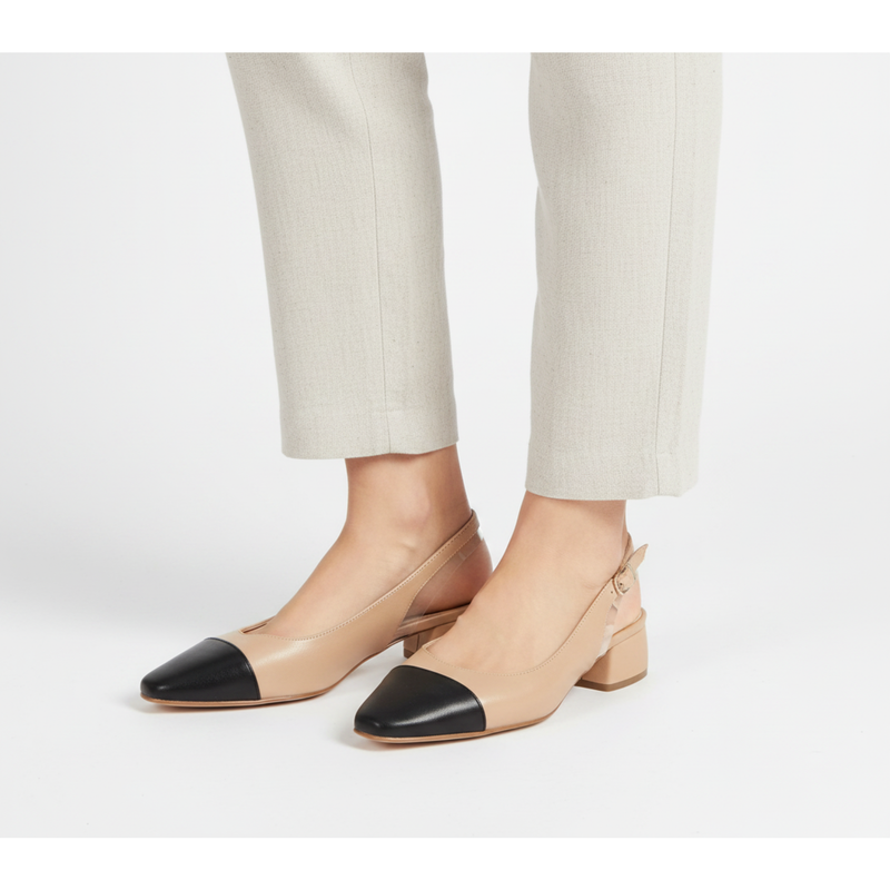 Menina Step Berta slingback nude shoes with pointed toes and elegant design, shown from a side angle on a lifestyle background.
