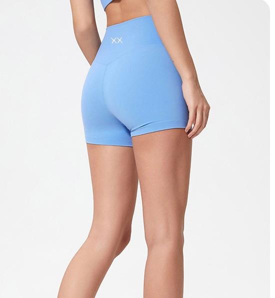 Pale blue Hele Short by BLACKOUT BARBELL, lightweight athletic shorts with a relaxed fit, ideal for activewear and casual wear.