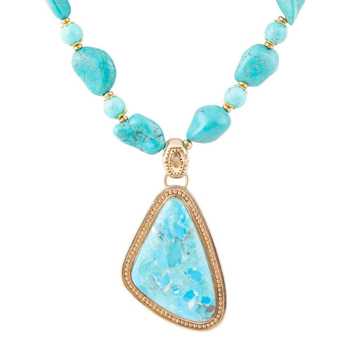 Blue turquoise triangle pendant necklace by Barse Jewelry featuring a golden chain and vibrant gemstone design.