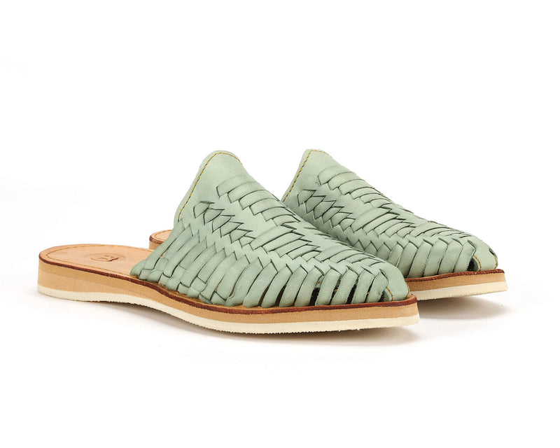 Teal Marbella Huarache Slip-On shoes by Bottomless Co. displayed on a neutral background, showcasing their stylish design.