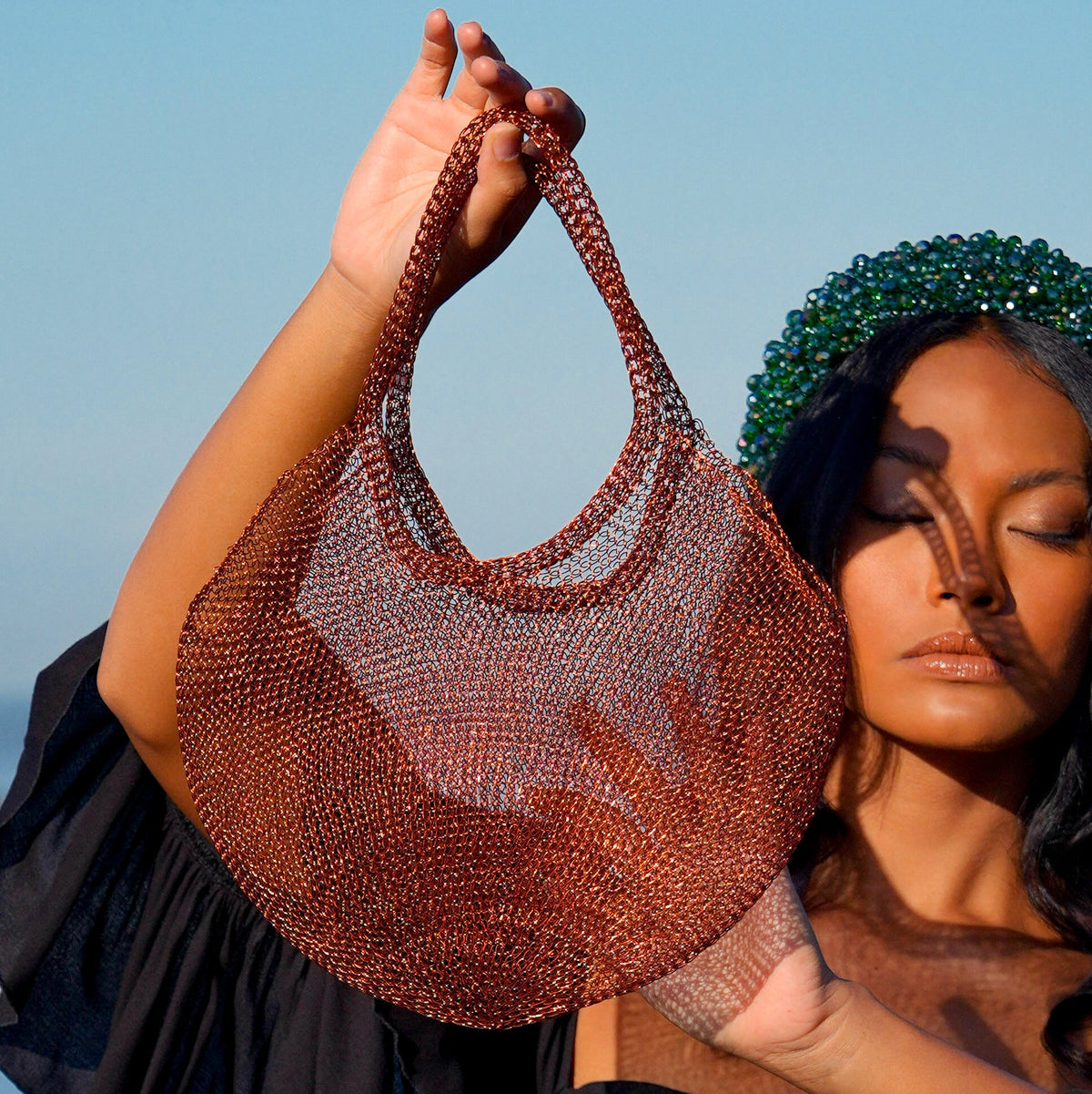 BrunnaCo Sol Mesh Wire Tote Bag in copper, stylish beach bag with open mesh wire design and sturdy handles.