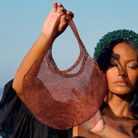 BrunnaCo Sol Mesh Wire Tote Bag in copper, stylish beach bag with open mesh wire design and sturdy handles.