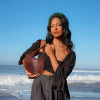 BrunnaCo Sol Mesh Wire Tote Bag in copper, stylish beach bag with open wire design and sturdy handles.