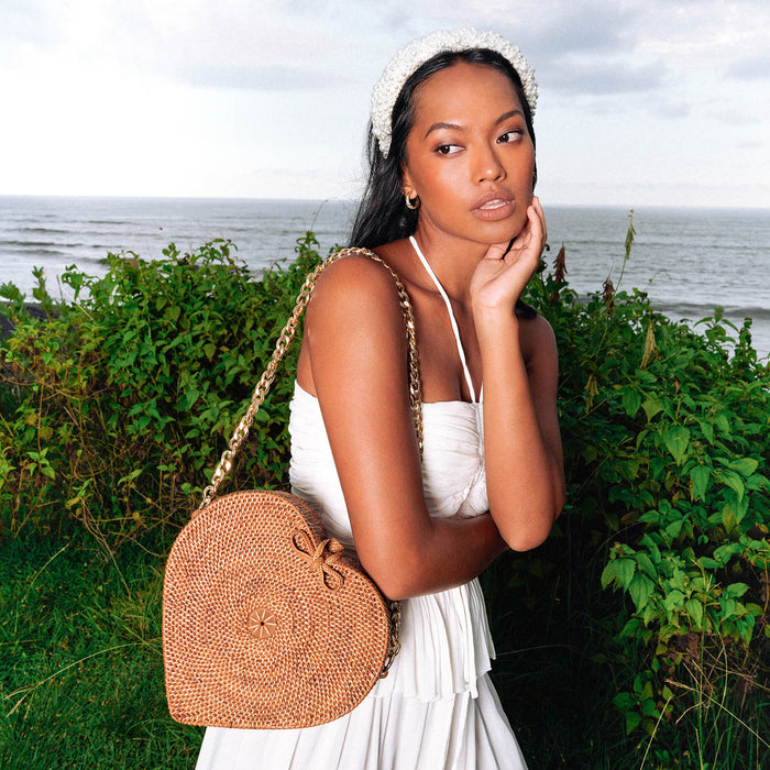 Natural brown rattan beach bag with gold shoulder chain strap by BrunnaCo, featuring a stylish Atta Atta Rattan Shoulder Bag design.