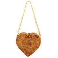 Natural brown CINTA Atta rattan shoulder beach bag by BrunnaCo with gold chain strap and woven rattan design.