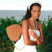 BrunnaCo CINTA Atta Rattan Shoulder Beach Bag in natural brown with gold chain strap, stylish and spacious for beach outings.