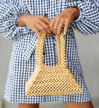 Beige pyramid beaded tote bag by BrunnaCo featuring geometric bead design and sturdy handles.