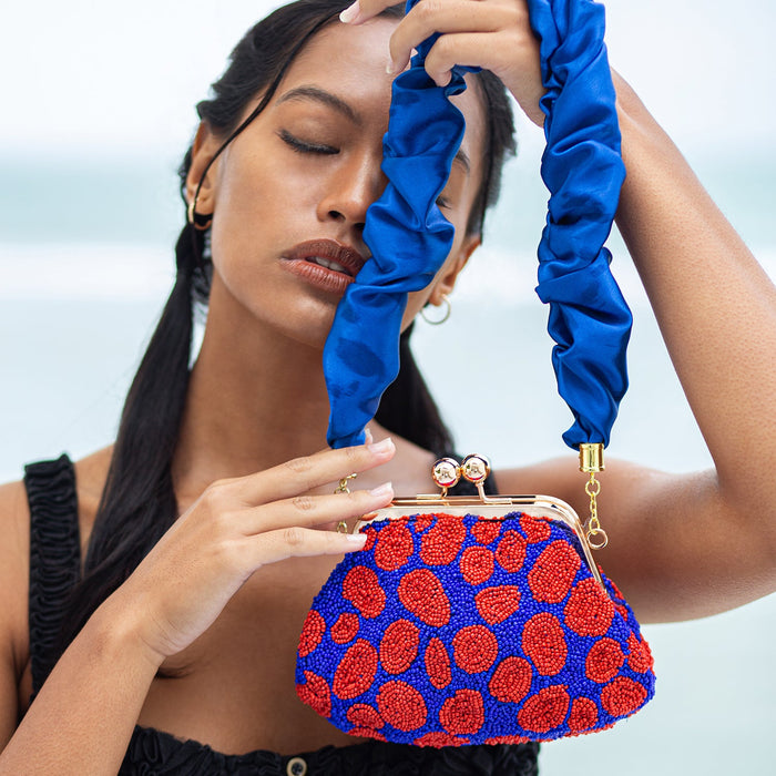 BrunnaCo Arnoldi Mandy hand-beaded clutch bag with intricate beadwork and a sleek, elegant design for evening events.