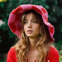 BrunnaCo Shilo checkered crochet hat in red and pink, stylish knit hat with a checkered pattern and cozy design.